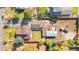 Overhead aerial view shows property layout, including home, garages, lot, and surrounding neighborhood at 1945 Yarrow St, Lakewood, CO 80214
