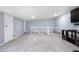 Open basement featuring carpet flooring and light colored walls and staircase access at 1945 Yarrow St, Lakewood, CO 80214