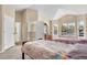 Bright bedroom featuring two beds, light colored walls, and large windows at 1945 Yarrow St, Lakewood, CO 80214