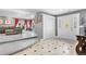 The foyer welcomes guests with a decorative front door and access to the living room at 1945 Yarrow St, Lakewood, CO 80214
