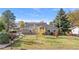 Charming home with a well-maintained lawn and mature trees at 1945 Yarrow St, Lakewood, CO 80214