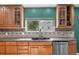 Gourmet kitchen with custom cabinetry, tile backsplash, and stainless steel appliances at 1945 Yarrow St, Lakewood, CO 80214