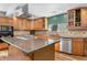 Well-equipped kitchen featuring granite countertops, stainless steel appliances, and custom cabinetry at 1945 Yarrow St, Lakewood, CO 80214