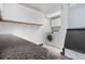 Well-lit laundry room with a washer, dryer, overhead cabinets, and ample countertop space at 1945 Yarrow St, Lakewood, CO 80214