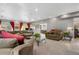This living room boasts a large sectional sofa and ample seating at 1945 Yarrow St, Lakewood, CO 80214