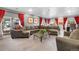 This expansive living room features a plush sectional sofa and ample natural light at 1945 Yarrow St, Lakewood, CO 80214