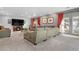 This living room features ample seating, a fireplace, and a large TV at 1945 Yarrow St, Lakewood, CO 80214