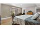 This is a large bedroom with natural light and hardwood floors at 1945 Yarrow St, Lakewood, CO 80214