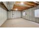 Spacious unfinished basement with concrete walls and exposed ceiling beams at 4720 S Bannock St, Englewood, CO 80110