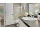 Bright bathroom boasts a shower, vanity, and contemporary decor at 4720 S Bannock St, Englewood, CO 80110