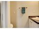 Cozy bathroom with neutral wall, towel rack, and a well-lit vanity at 4720 S Bannock St, Englewood, CO 80110