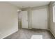 Bright bedroom featuring neutral walls, carpet, closet and a sunny window at 4720 S Bannock St, Englewood, CO 80110