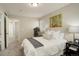 Inviting bedroom features neutral walls, art, large windows and soft carpet at 4720 S Bannock St, Englewood, CO 80110