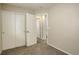 Neutral carpeted room with closet, and access to the ensuite bathroom at 4720 S Bannock St, Englewood, CO 80110