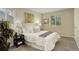 Comfortable bedroom with soft carpet, large windows and stylish decor at 4720 S Bannock St, Englewood, CO 80110