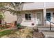 The exterior of this charming property features a tidy yard and a cozy front porch at 4720 S Bannock St, Englewood, CO 80110