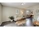 Inviting living room with stylish furnishings and open access to the dining area at 4720 S Bannock St, Englewood, CO 80110