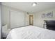 Bedroom featuring light walls, closet, and neutral décor with a view of the hall at 591 Rio Rancho Way, Brighton, CO 80601