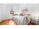 Charming bedroom with hardwood floors and a daybed at 3403 N Raleigh St, Denver, CO 80212