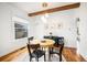 Bright dining area with hardwood floors and modern light fixture at 3403 N Raleigh St, Denver, CO 80212