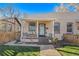 Updated craftsman bungalow with light teal door at 3403 N Raleigh St, Denver, CO 80212