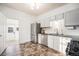 Modern kitchen with stainless steel appliances and ample cabinet space at 3403 N Raleigh St, Denver, CO 80212