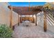 Brick patio with pergola, table, chairs, and fire pit at 3403 N Raleigh St, Denver, CO 80212