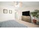 Bedroom with a ceiling fan and closet, plus a large dresser for storage at 10818 Cimarron St # 206, Firestone, CO 80504