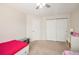 Shared bedroom with twin beds, closet, and simple decor at 10818 Cimarron St # 206, Firestone, CO 80504