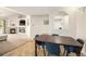Dining room with tile flooring, next to kitchen, and view of the fireplace in the living room at 10818 Cimarron St # 206, Firestone, CO 80504