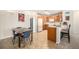 Kitchen features wooden cabinets, neutral countertops, a breakfast bar, and includes a dining area at 10818 Cimarron St # 206, Firestone, CO 80504