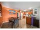 Eat-in kitchen and dining space featuring oak cabinets, tiled flooring and modern appliances at 10818 Cimarron St # 206, Firestone, CO 80504