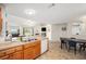 Open kitchen flows into the dining and living areas, enhancing the living space at 10818 Cimarron St # 206, Firestone, CO 80504