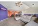 Open-concept living space with modern decor, open to the dining and kitchen areas at 10818 Cimarron St # 206, Firestone, CO 80504