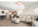 Living room showcases an open-concept layout with views into the kitchen and dining area at 10818 Cimarron St # 206, Firestone, CO 80504