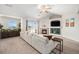 Inviting living room features a fireplace, a ceiling fan, and sliding door access to the outdoor space at 10818 Cimarron St # 206, Firestone, CO 80504