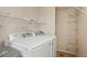 A convenient laundry area with new washer and dryer units and wire shelving at 4604 Flanders Way, Denver, CO 80249