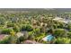 Aerial view of a well maintained community, showcasing mature trees, pool and tennis court at 1758 S Pitkin Cir # A, Aurora, CO 80017