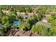 Aerial view of a community with a pool, tennis court, and well-maintained landscaping at 1758 S Pitkin Cir # A, Aurora, CO 80017