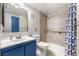 Bathroom featuring a walk-in shower and a stylish vanity at 1758 S Pitkin Cir # A, Aurora, CO 80017
