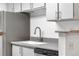 Modern kitchen features stainless steel appliances, gray counters and ample storage at 1758 S Pitkin Cir # A, Aurora, CO 80017