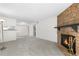 Spacious living room featuring a stone fireplace and open layout at 1758 S Pitkin Cir # A, Aurora, CO 80017