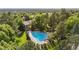 Community pool surrounded by green space and mature trees in a well maintained community at 1758 S Pitkin Cir # A, Aurora, CO 80017