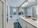 Bathroom features a double sink, a large mirror, and a soaking tub at 1416 Red Mica Way, Monument, CO 80132