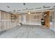 Spacious garage with concrete floors, exposed walls with shelving, and an overhead garage door at 1416 Red Mica Way, Monument, CO 80132