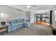 Open-concept living room flows into the kitchen with hardwood floors and plentiful natural light at 1416 Red Mica Way, Monument, CO 80132