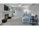 Inviting living room with plush carpeting, cozy fireplace, and comfortable seating at 1416 Red Mica Way, Monument, CO 80132