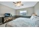 Main bedroom featuring carpet, ceiling fan, a large window, and a mountain themed dresser at 1416 Red Mica Way, Monument, CO 80132