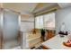 Bright bathroom featuring a tub, a shower and large windows at 8555 Angela Ln, Parker, CO 80134