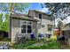 Back exterior view of the home with a small patio and neat yard at 8555 Angela Ln, Parker, CO 80134